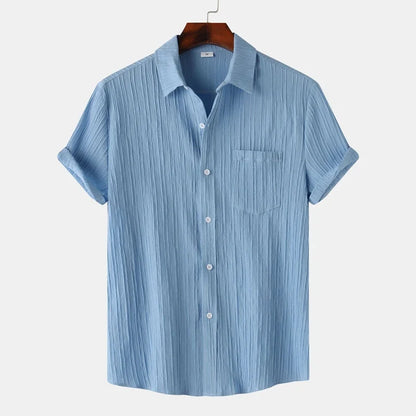 Breathable men's lightweight coastal button-down shirt. Classic fit for comfortable summer days & resort fashion.