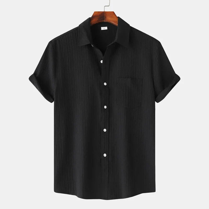 Stylish men's short-sleeve button-down shirt. Lightweight, coastal design, perfect for summer casual & resort.