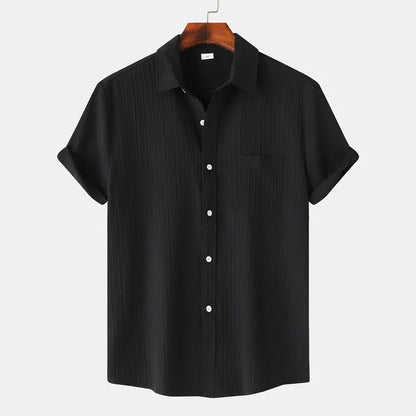 Stylish men's short-sleeve button-down shirt. Lightweight, coastal design, perfect for summer casual & resort.
