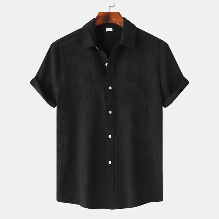Stylish men's short-sleeve button-down shirt. Lightweight, coastal design, perfect for summer casual & resort.