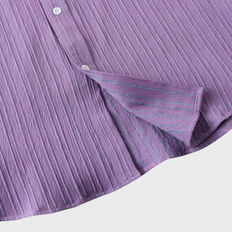 Close-up of a lightweight men's coastal button-down shirt fabric. Soft, comfortable, perfect for summer wear.