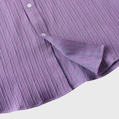Close-up of a lightweight men's coastal button-down shirt fabric. Soft, comfortable, perfect for summer wear.