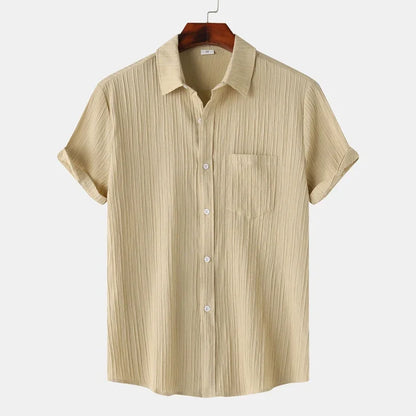 Short-sleeve men's button-down shirt with coastal vibes. Lightweight & comfortable for versatile summer fashion.