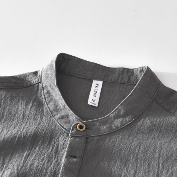 Men's smart casual collarless popover shirt. Lightweight long sleeve design, ideal for summer style and comfort.