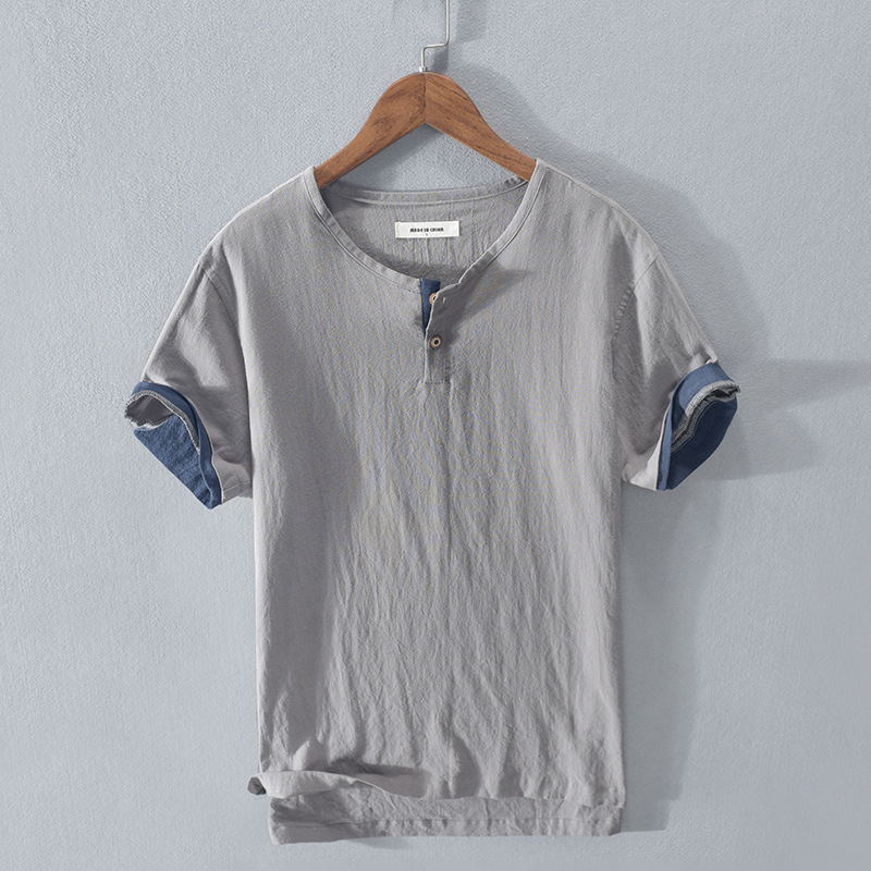 Men's lightweight Henley shirt in a relaxed fit, perfect for stylish summer casual wear. Breathable short sleeve top.