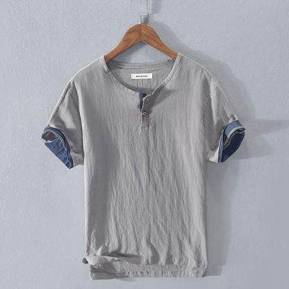 Men's lightweight Henley shirt in a relaxed fit, perfect for stylish summer casual wear. Breathable short sleeve top.