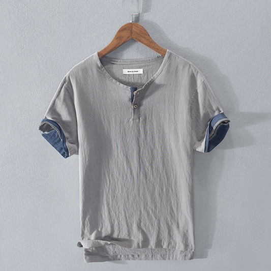 Men's lightweight Henley shirt in a relaxed fit, perfect for stylish summer casual wear. Breathable short sleeve top.