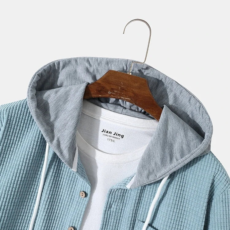 Versatile men's hooded long sleeve button-up shirt, ideal as a layering top for autumn.