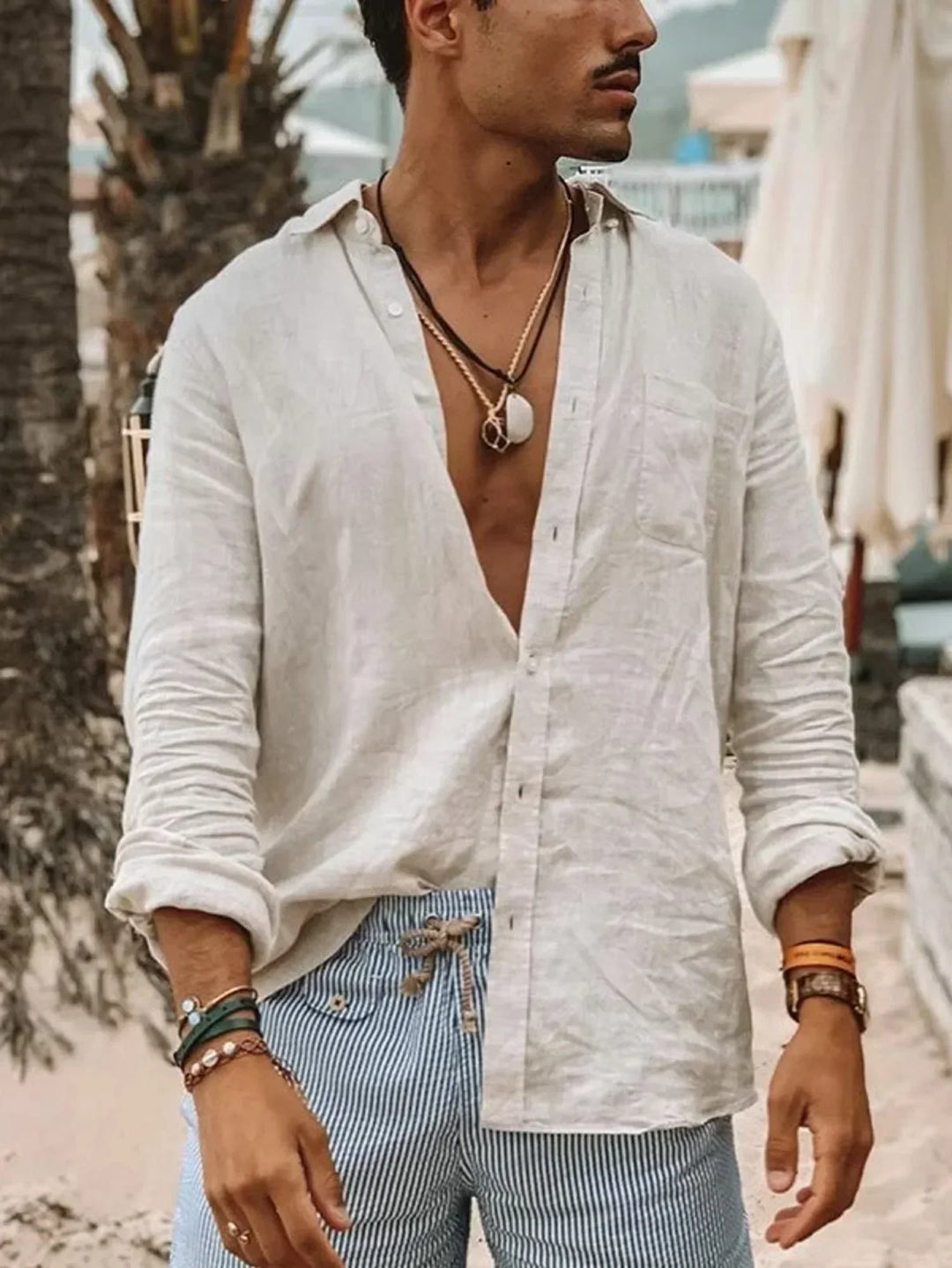 Relaxed fit men's lightweight linen button-up shirt, perfect summer apparel for a stylish and cool look.