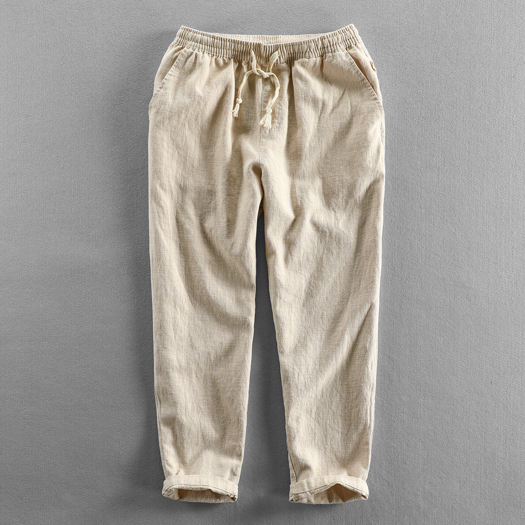 Men's lightweight linen drawstring trousers for a relaxed, breathable summer look.