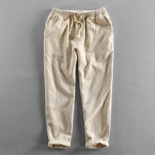 Men's lightweight linen drawstring trousers for a relaxed, breathable summer look.