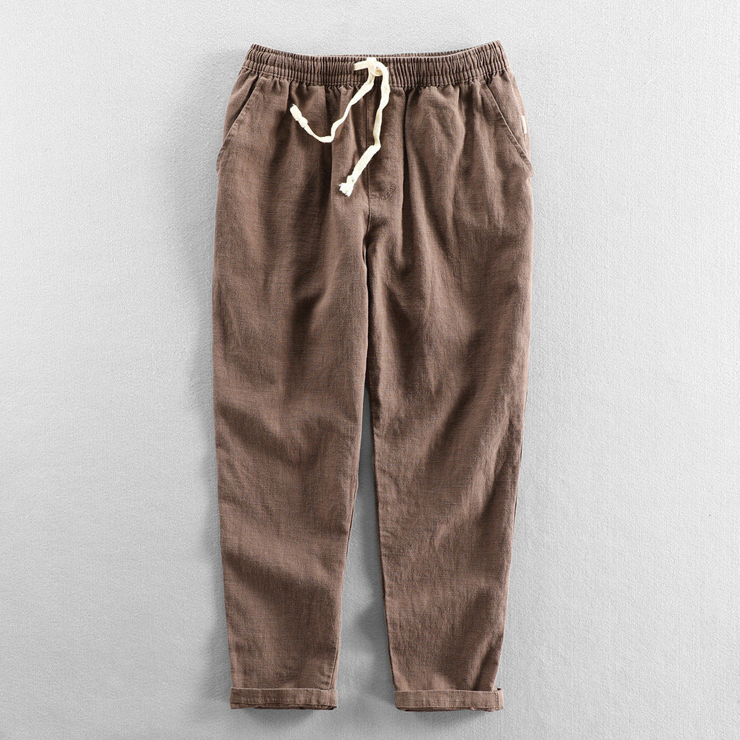 Casual men's linen pants with drawstring waist, perfect for summer comfort and breathability.