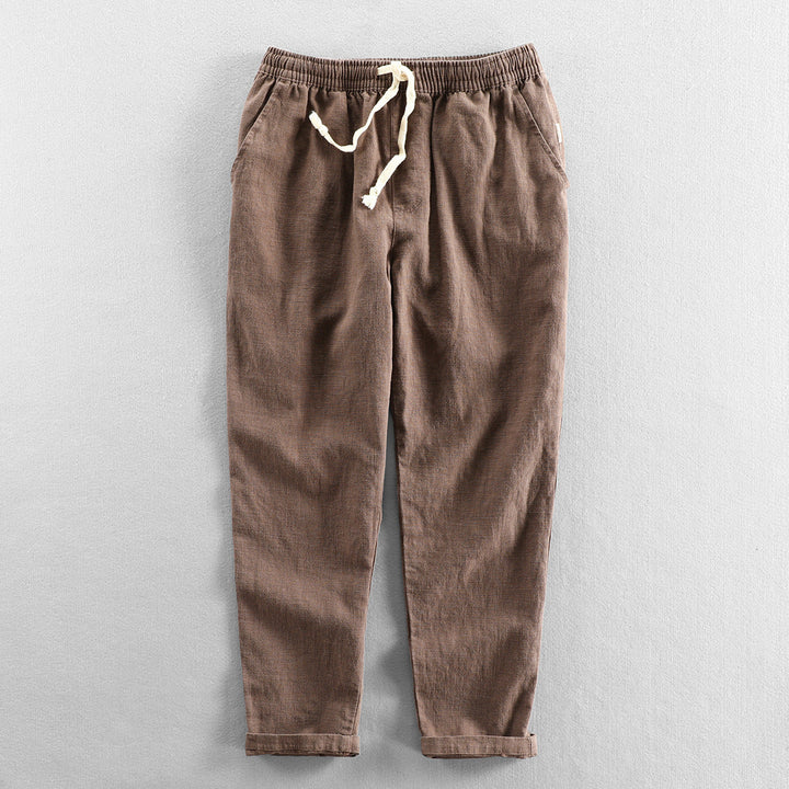 Casual men's linen pants with drawstring waist, perfect for summer comfort and breathability.