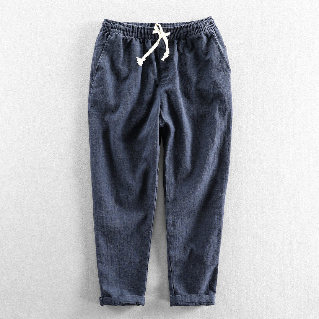 Relaxed fit men's linen trousers, lightweight and breathable with an adjustable drawstring waist.