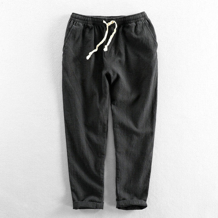 Lightweight men's linen drawstring trousers for a relaxed fit; perfect breathable bottoms for summer.