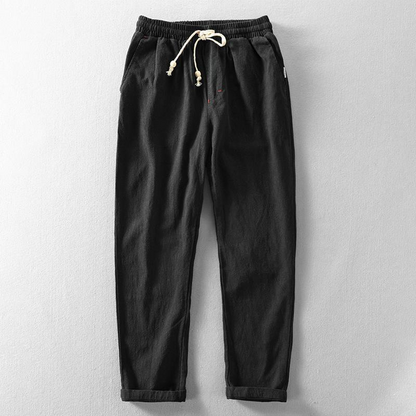 Casual men's relaxed fit linen pants with drawstring, ideal for breathable summer wear.