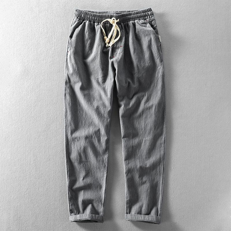 Stylish men's linen drawstring trousers, relaxed fit for casual and comfortable summer days.