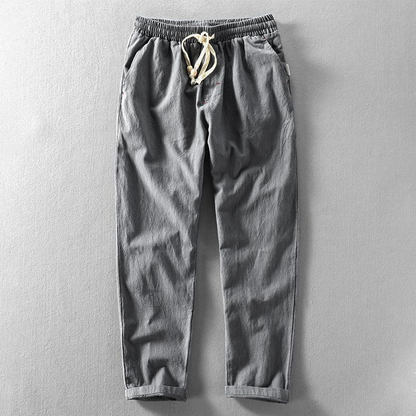 Stylish men's linen drawstring trousers, relaxed fit for casual and comfortable summer days.