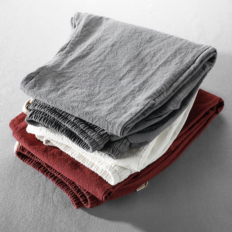 Men's summer linen trousers, relaxed fit design for breathable comfort and casual style.