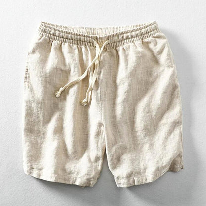 Detail of men's lightweight pinstripe casual shorts showing elastic waist and adjustable drawstring.