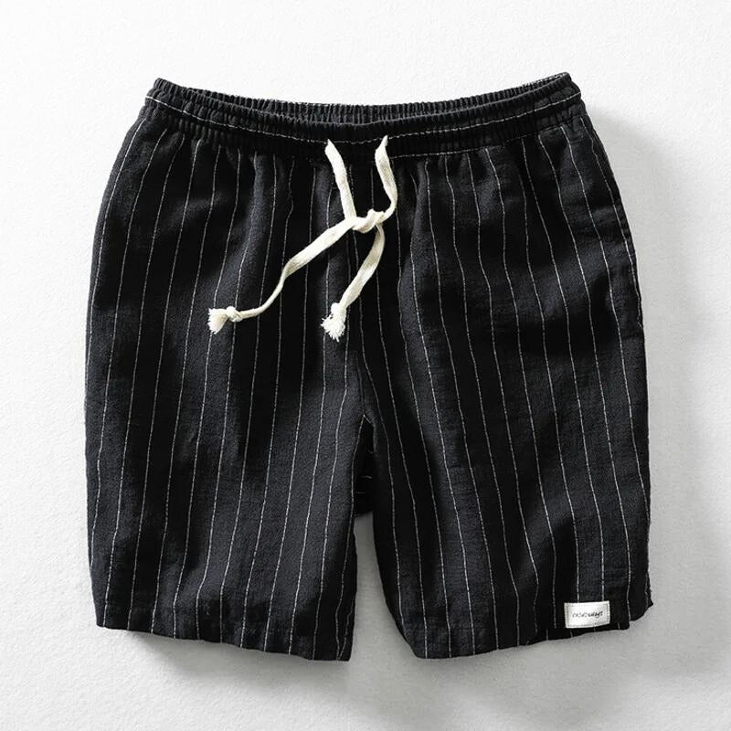Man wearing comfortable, lightweight pinstripe casual shorts for men, ideal for summer outdoor activities.