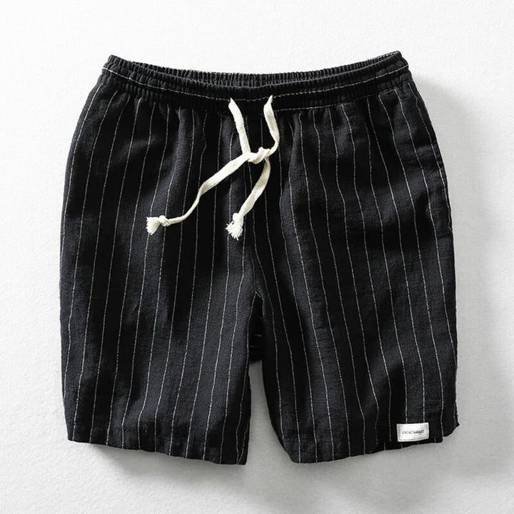 Man wearing comfortable, lightweight pinstripe casual shorts for men, ideal for summer outdoor activities.