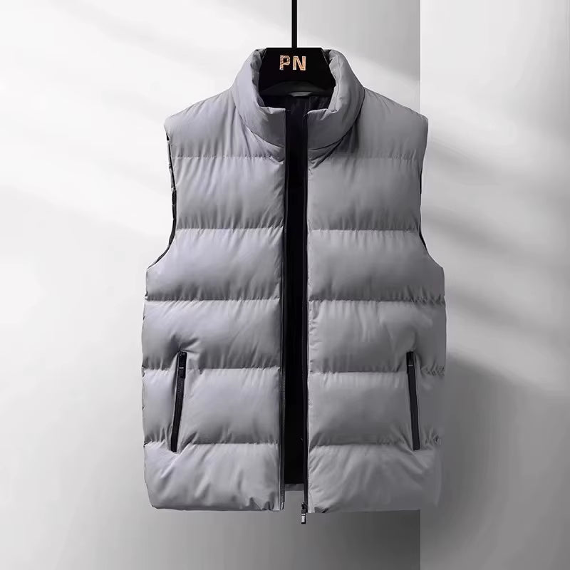 Stylish men's puffer vest in black, providing lightweight warmth and wind protection for winter fashion & activewear.
