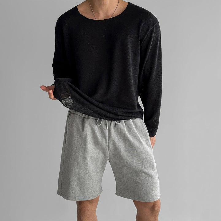 Men's casual long-sleeve pullover in a lightweight fabric, featuring a comfortable relaxed fit.