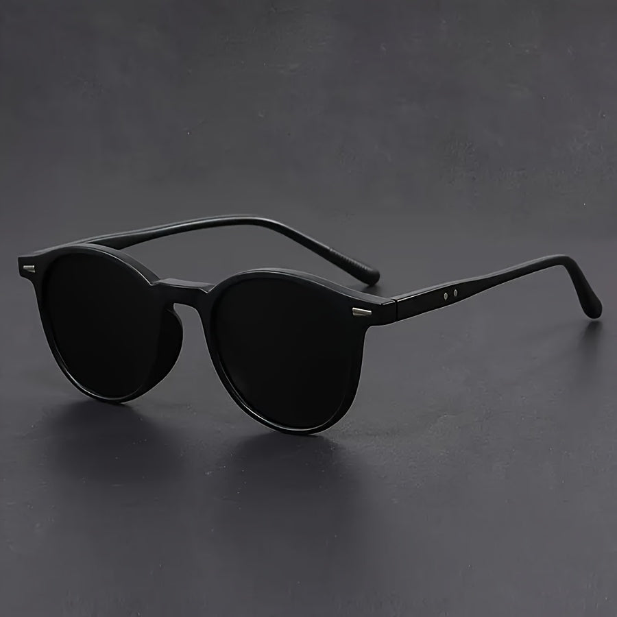 Close-up of men's retro round tortoiseshell sunglasses, highlighting the unique pattern and lightweight frame.
