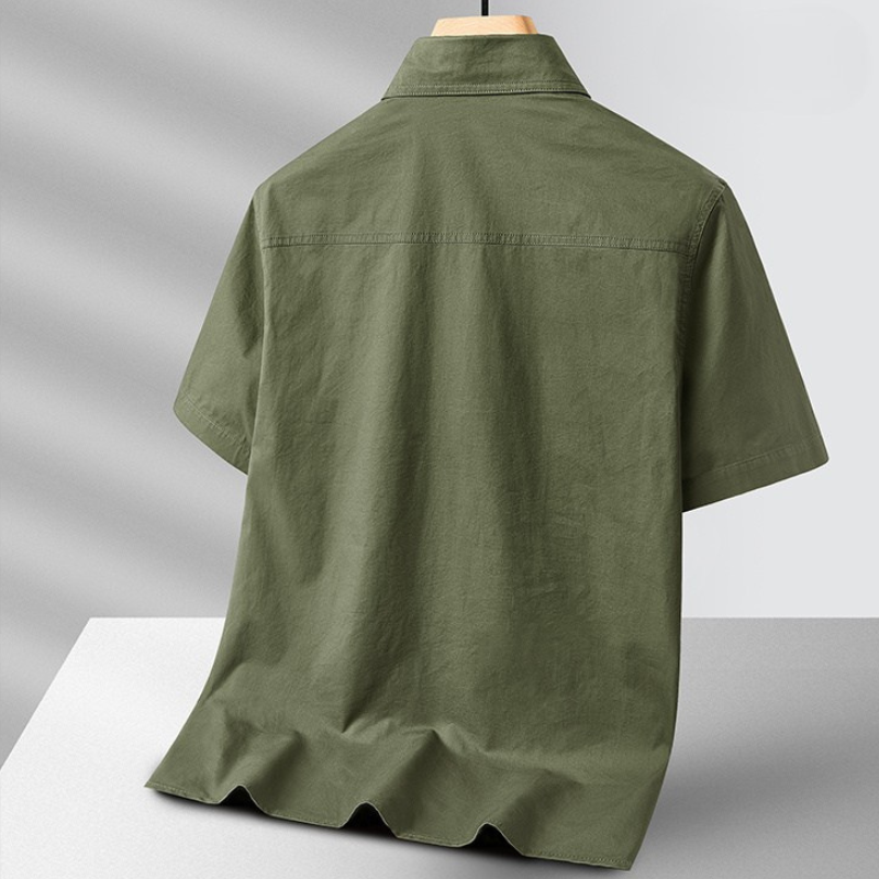 Close-up of men's adventure field shirt, showing durable lightweight fabric and utility pockets for outdoor wear.