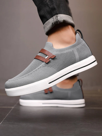 Casual men's laceless loafers with mesh upper for a stylish, comfortable everyday look.