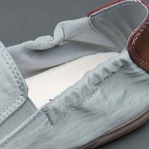 Convenient men's lightweight slip-on footwear, great for quick outings or travel comfort.