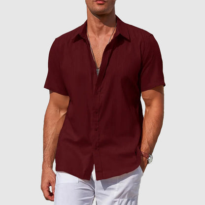 Man models a relaxed fit lightweight summer shirt, perfect for warm weather casual style & everyday comfort.