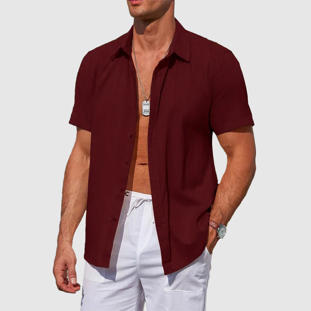 Front view of men's short-sleeve summer shirt, lightweight, relaxed fit, ideal for warm weather comfort.