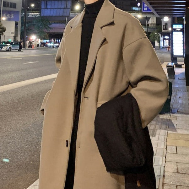 Stylish beige men's long overcoat with belt, ideal trench coat outerwear for smart casual and formal occasions.