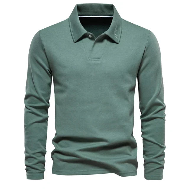 Modern men's long-sleeve polo, turn-down collar, embroidered detail, ideal for contemporary fashion.