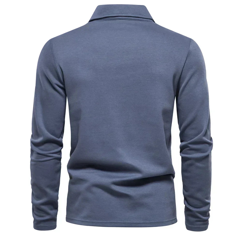 Stylish men's long-sleeve polo shirt, features a turn-down collar & embroidered detail.