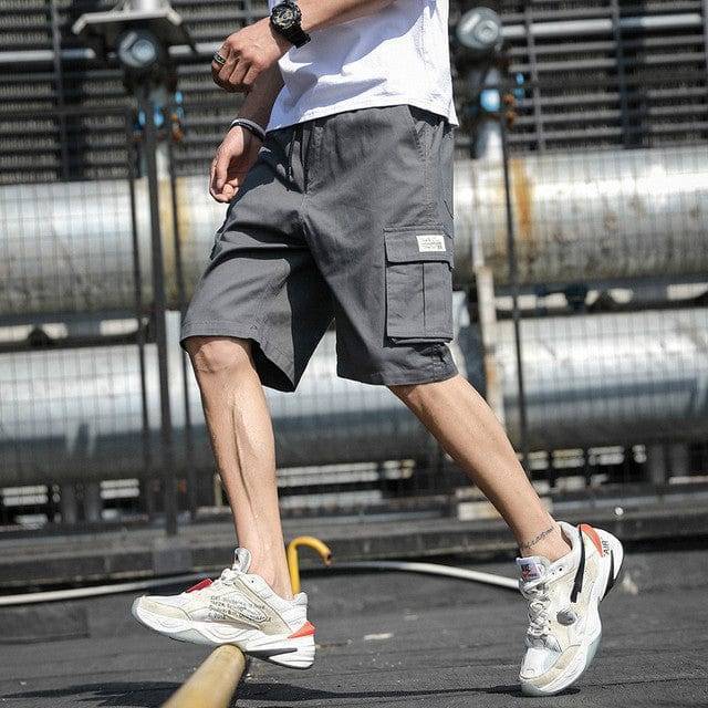 Comfortable men's knee-length shorts, cotton fabric with drawstring and cargo pockets.