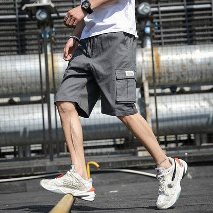 Comfortable men's knee-length shorts, cotton fabric with drawstring and cargo pockets.