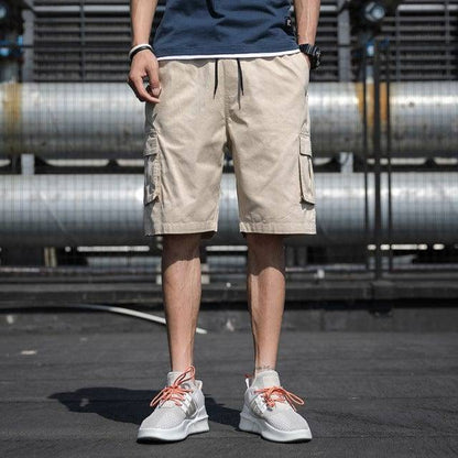 Loose fit men's cotton shorts, knee-length design with adjustable drawstring for casual style.