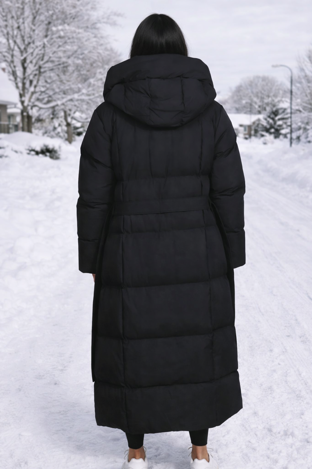 Stylish men's longline puffer jacket, hooded and insulated for superior winter warmth and outerwear comfort.