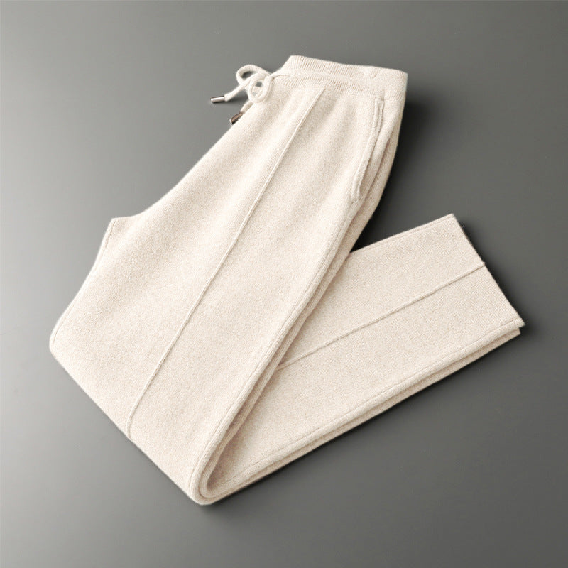 Close-up: Luxurious knit of men's cashmere blend lounge trousers, highlighting softness & quality.