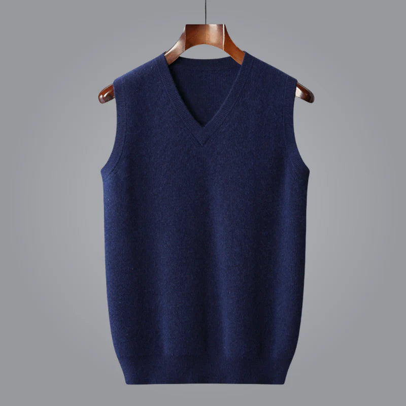 Man wearing a men's cashmere V-neck vest casually over a shirt for relaxed luxury.