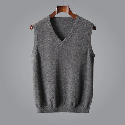 Man in tailored suit with luxurious cashmere V-neck vest, a sophisticated layering piece for men.