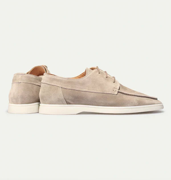 Premium men's beige loafers with lace-up closure, designed for luxurious comfort and versatile everyday wear.