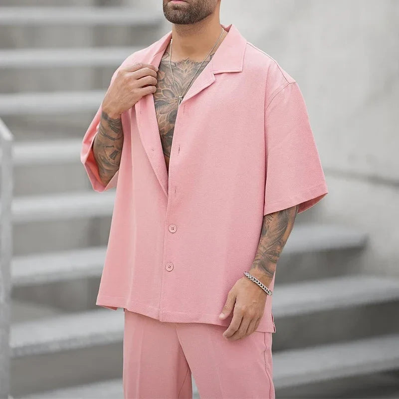 Modern men's elegant button shirt & dress pants set. Perfect luxury outfit for business or events.