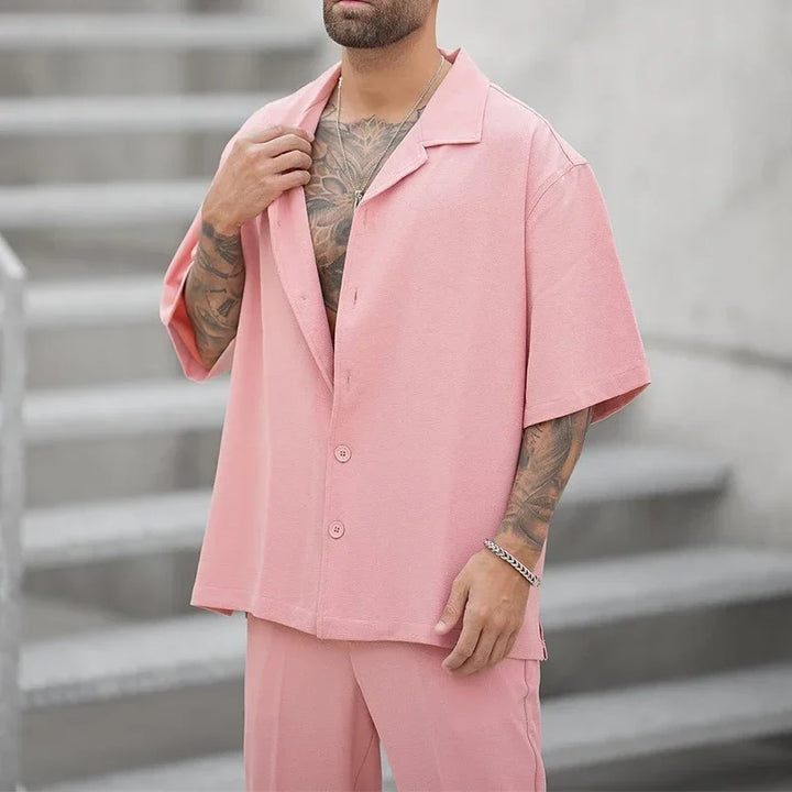 Modern men's elegant button shirt & dress pants set. Perfect luxury outfit for business or events.