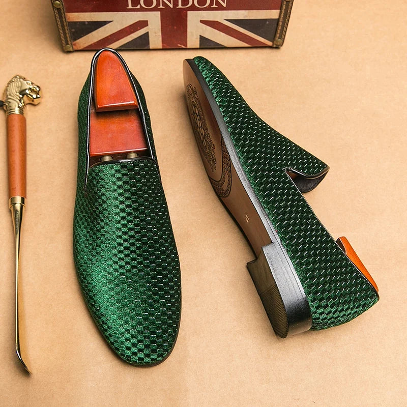 Elegant men's black leather slip-on loafers, combining comfort with sophisticated fashion.