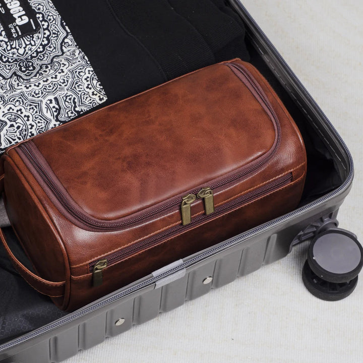 Waterproof men's travel toiletry bag for organized grooming essentials. Durable luxury wash bag dopp kit for travel.