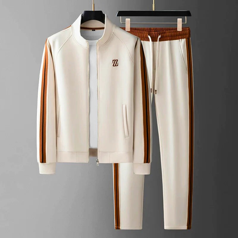 Stylish Men's Manor two-piece tracksuit. Features a zip-up jacket & matching trousers for comfortable athleisure fashion.
